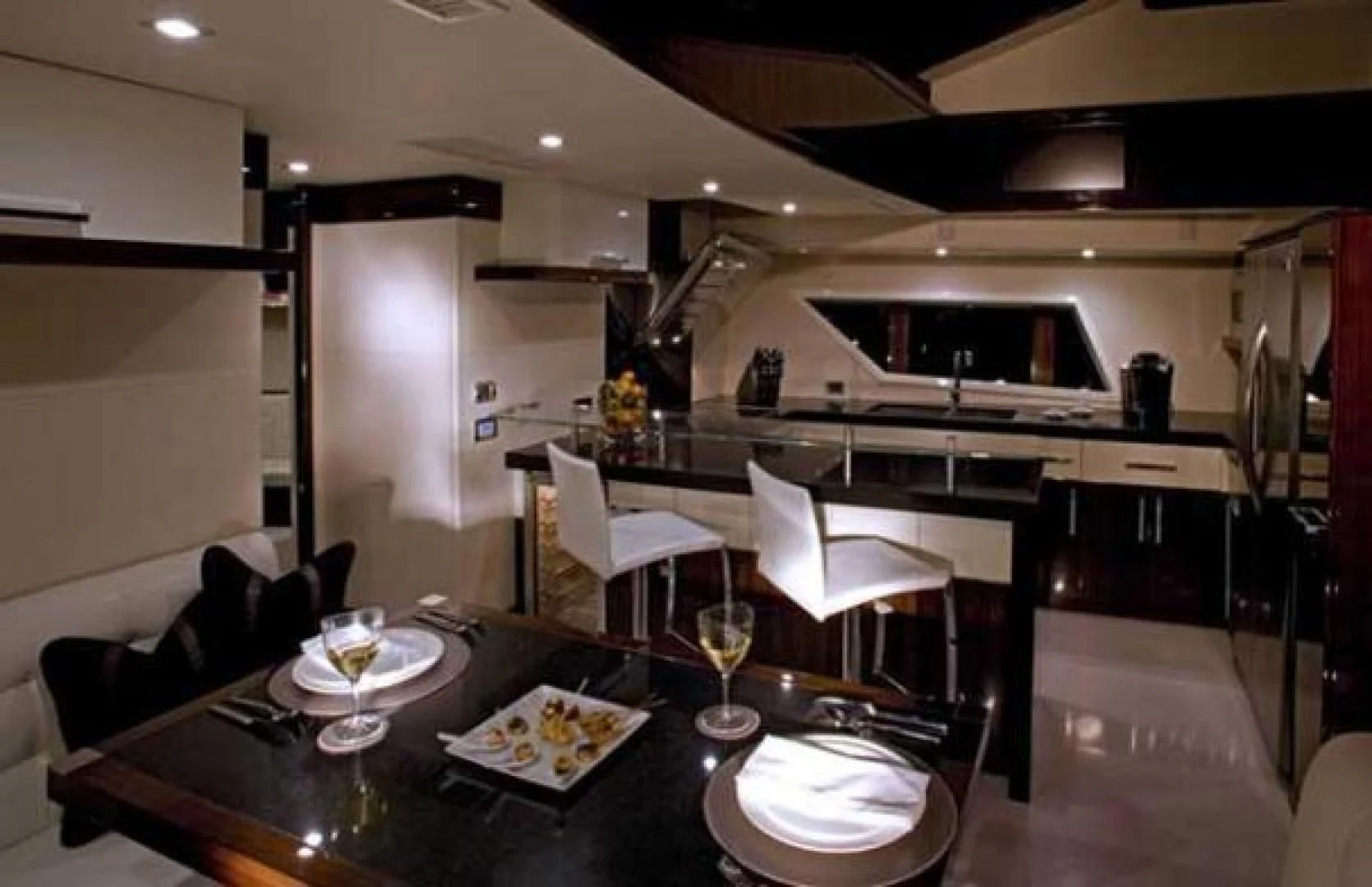 a kitchen with a table and chairs aboard CHAPTER II Yacht for Sale