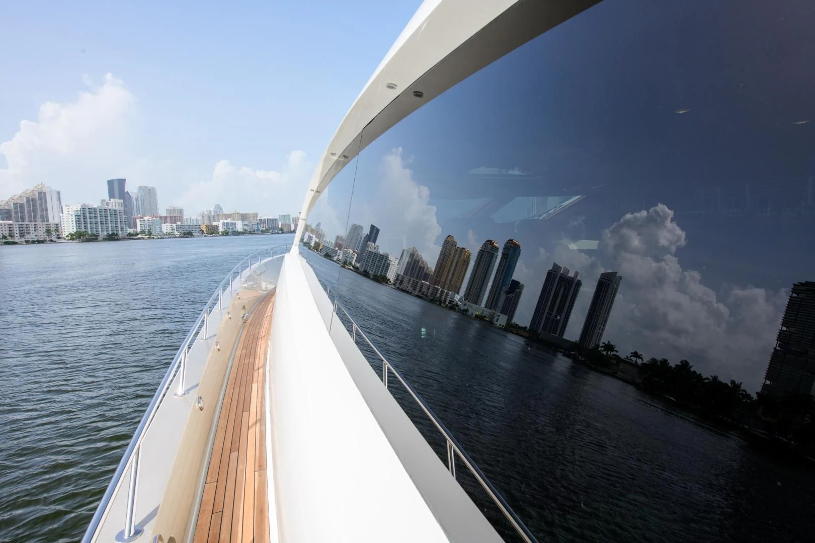 a bridge over water with a city in the background aboard CHAPTER II Yacht for Sale