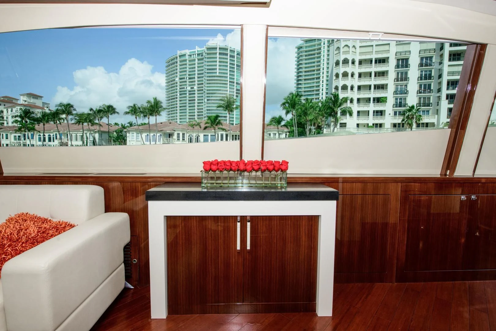 a room with a table and a couch and a window aboard CHAPTER II Yacht for Sale