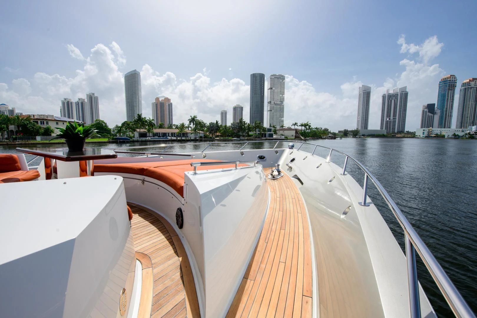 a large boat on a body of water with a city in the background aboard CHAPTER II Yacht for Sale