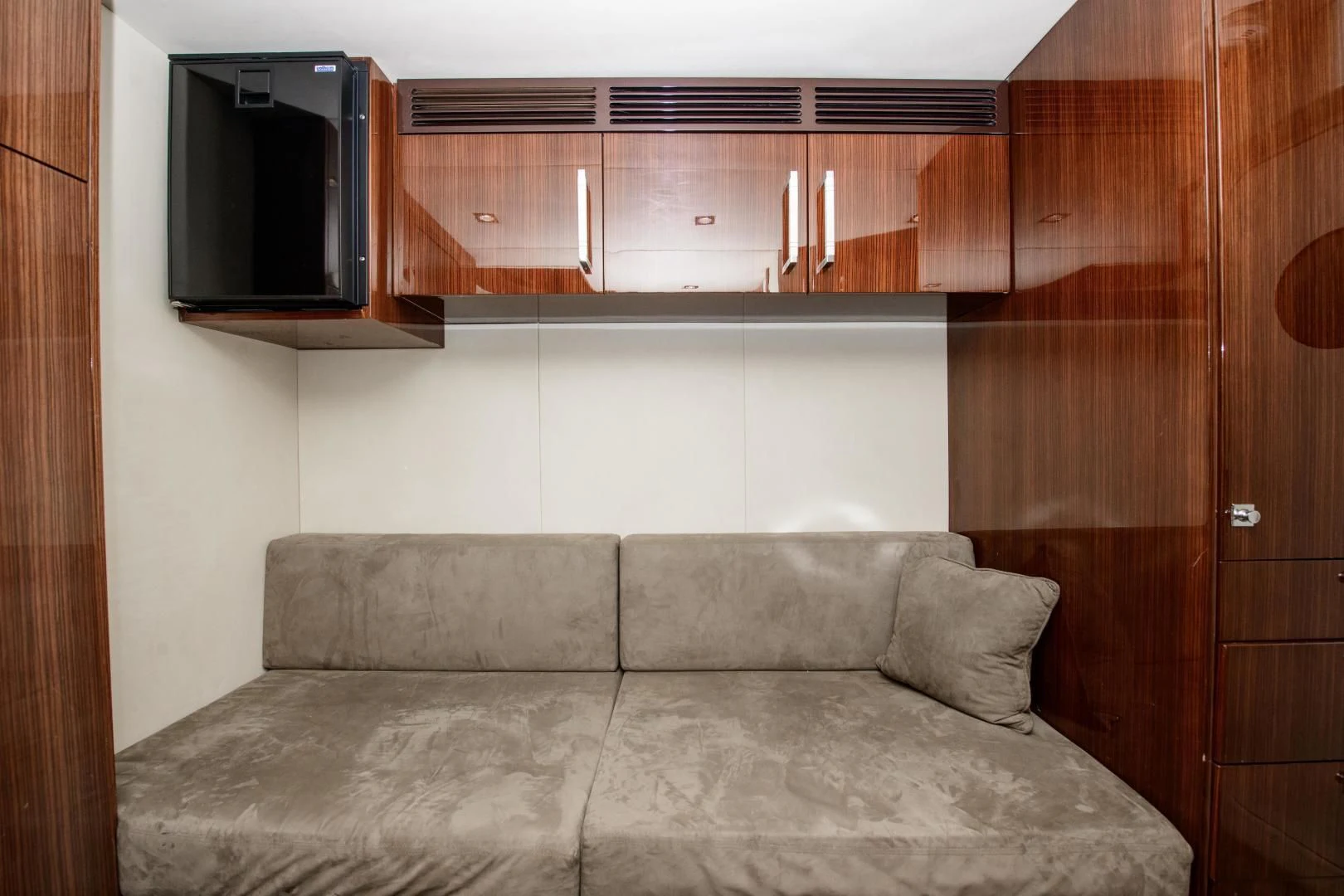 a couch in a room aboard CHAPTER II Yacht for Sale
