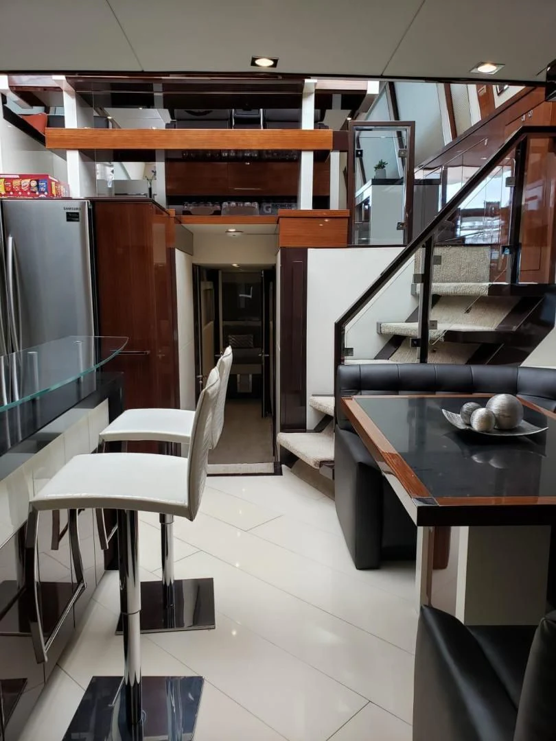 a kitchen with a table and chairs aboard CHAPTER II Yacht for Sale