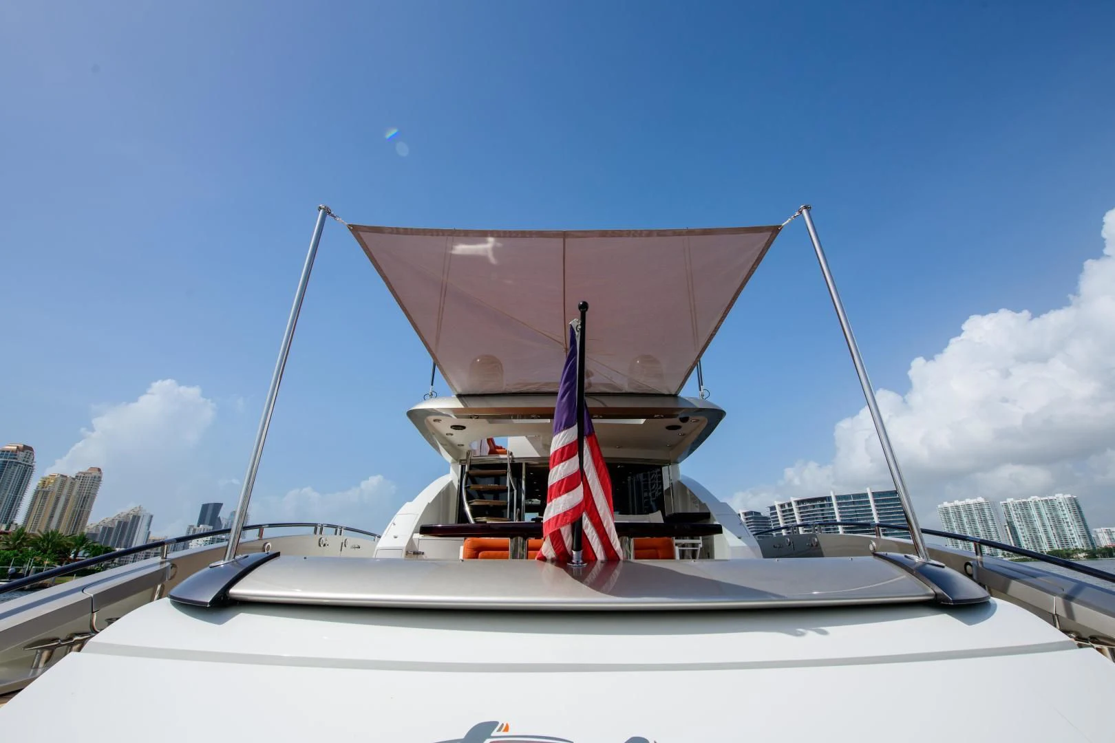a boat with a flag on it aboard CHAPTER II Yacht for Sale