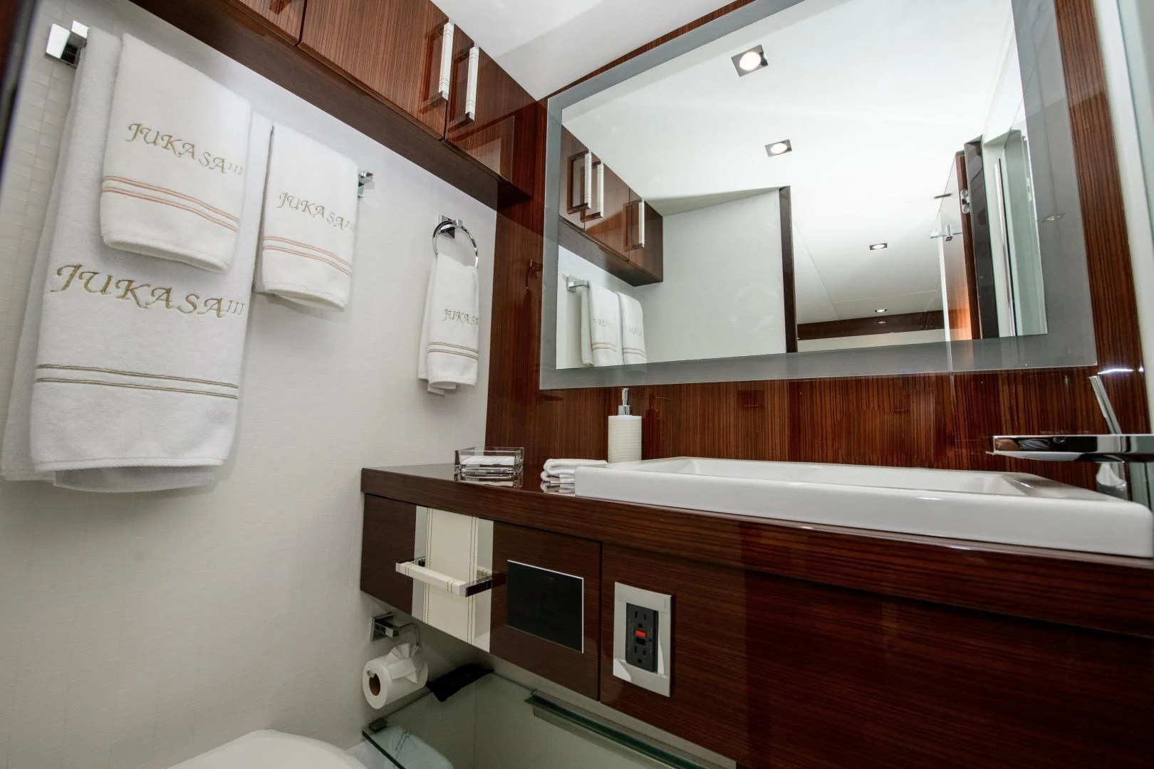 a bathroom with a large mirror aboard CHAPTER II Yacht for Sale