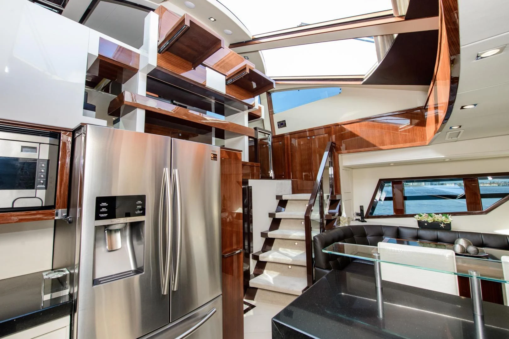a large kitchen with a large refrigerator aboard CHAPTER II Yacht for Sale