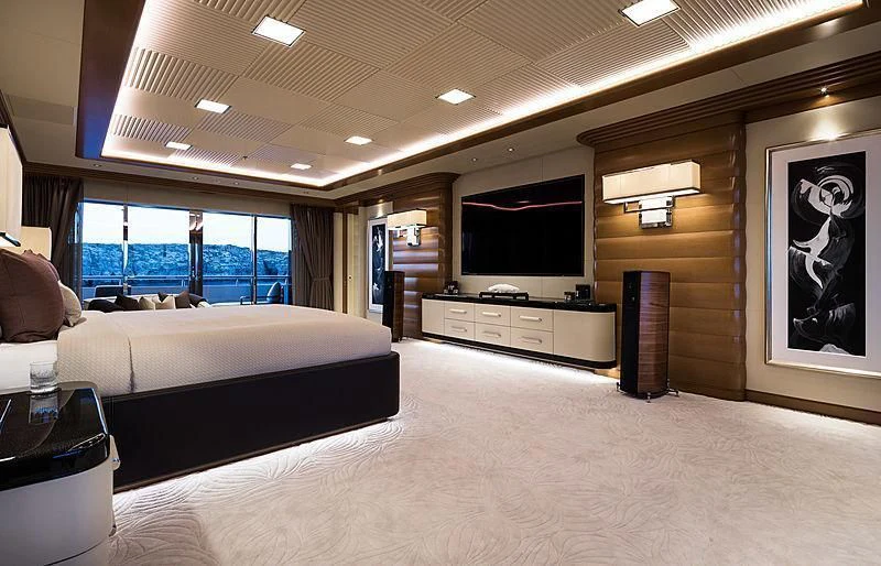 a room with a large bed and a tv aboard MAR Yacht for Sale