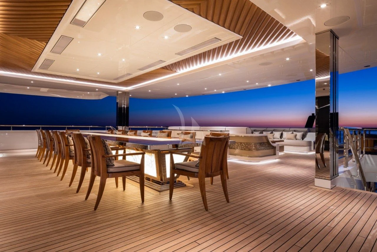 a room with a table and chairs aboard MAR Yacht for Sale
