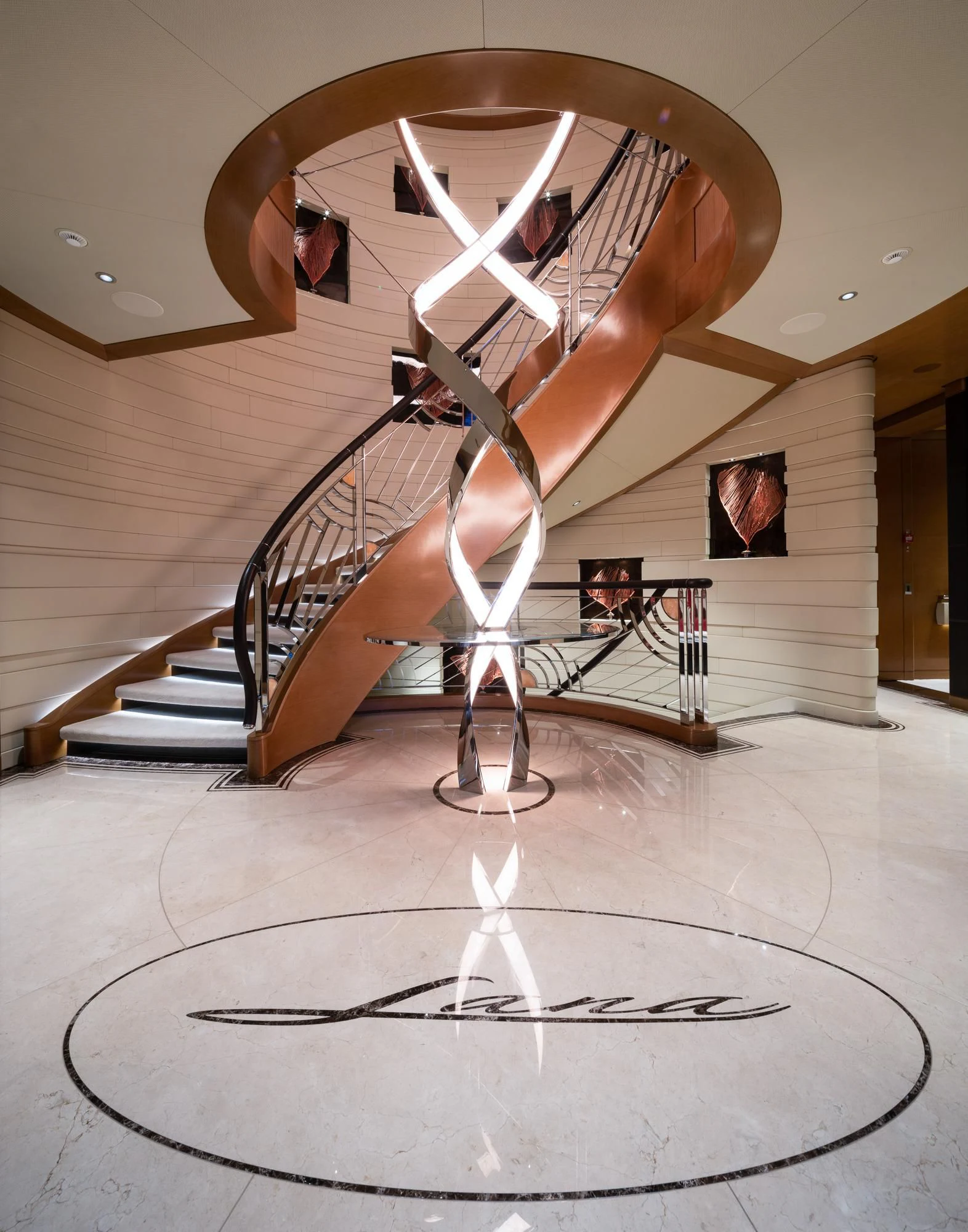 a sculpture of a person in a room with a staircase and a large ceiling aboard MAR Yacht for Sale