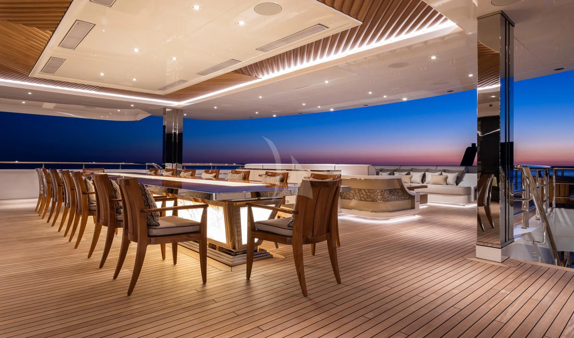 a room with a table and chairs aboard MAR Yacht for Sale