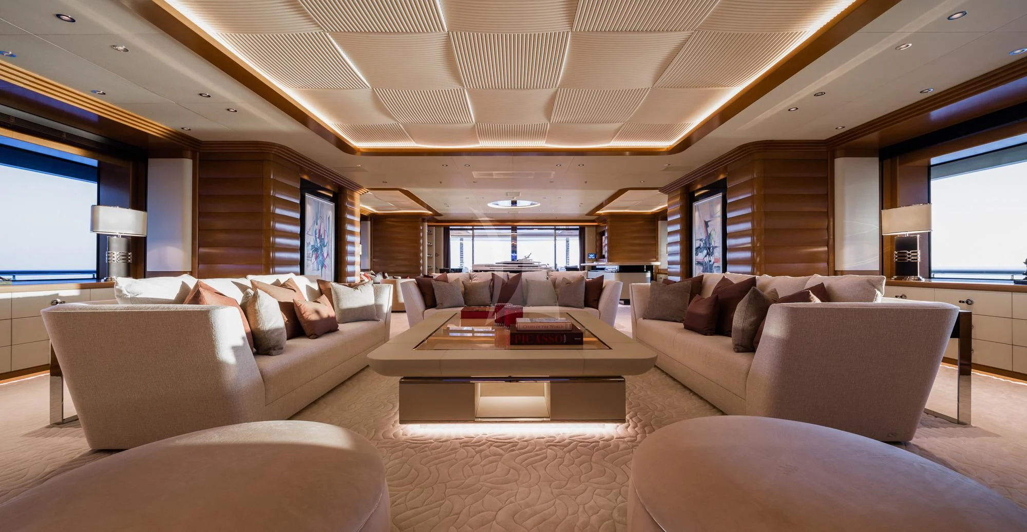 a living room with a large sofa and a coffee table aboard MAR Yacht for Sale