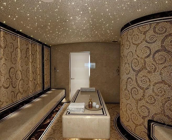 a room with a table and a couch aboard MAR Yacht for Sale