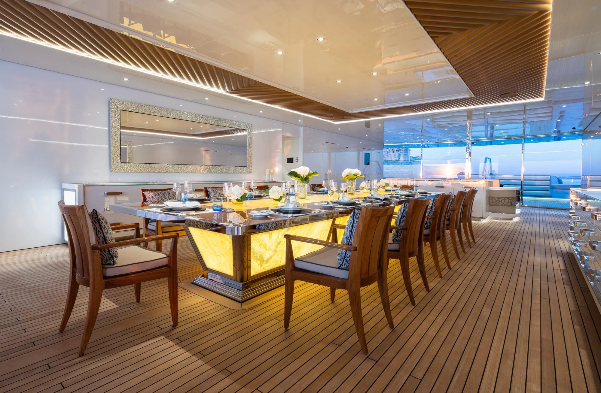 a room with a table and chairs aboard MAR Yacht for Sale