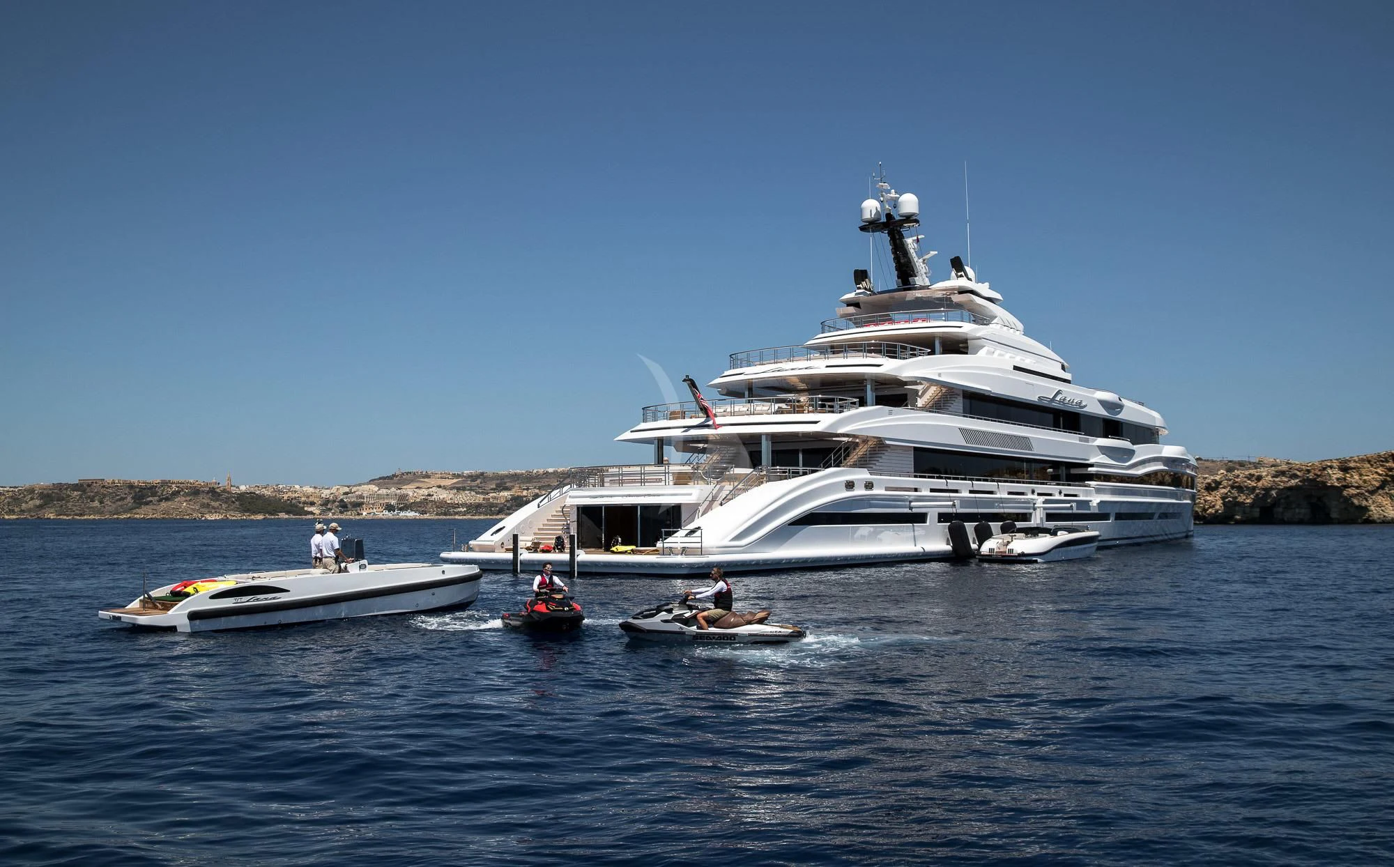 a large white boat with a couple of people on it aboard MAR Yacht for Sale