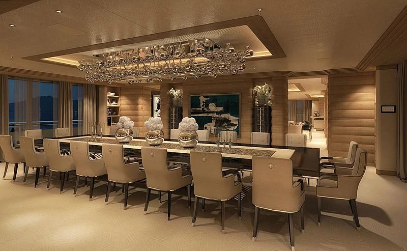 a large room with a table and chairs aboard MAR Yacht for Sale