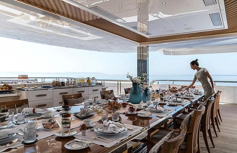 a person sitting at a table aboard MAR Yacht for Sale