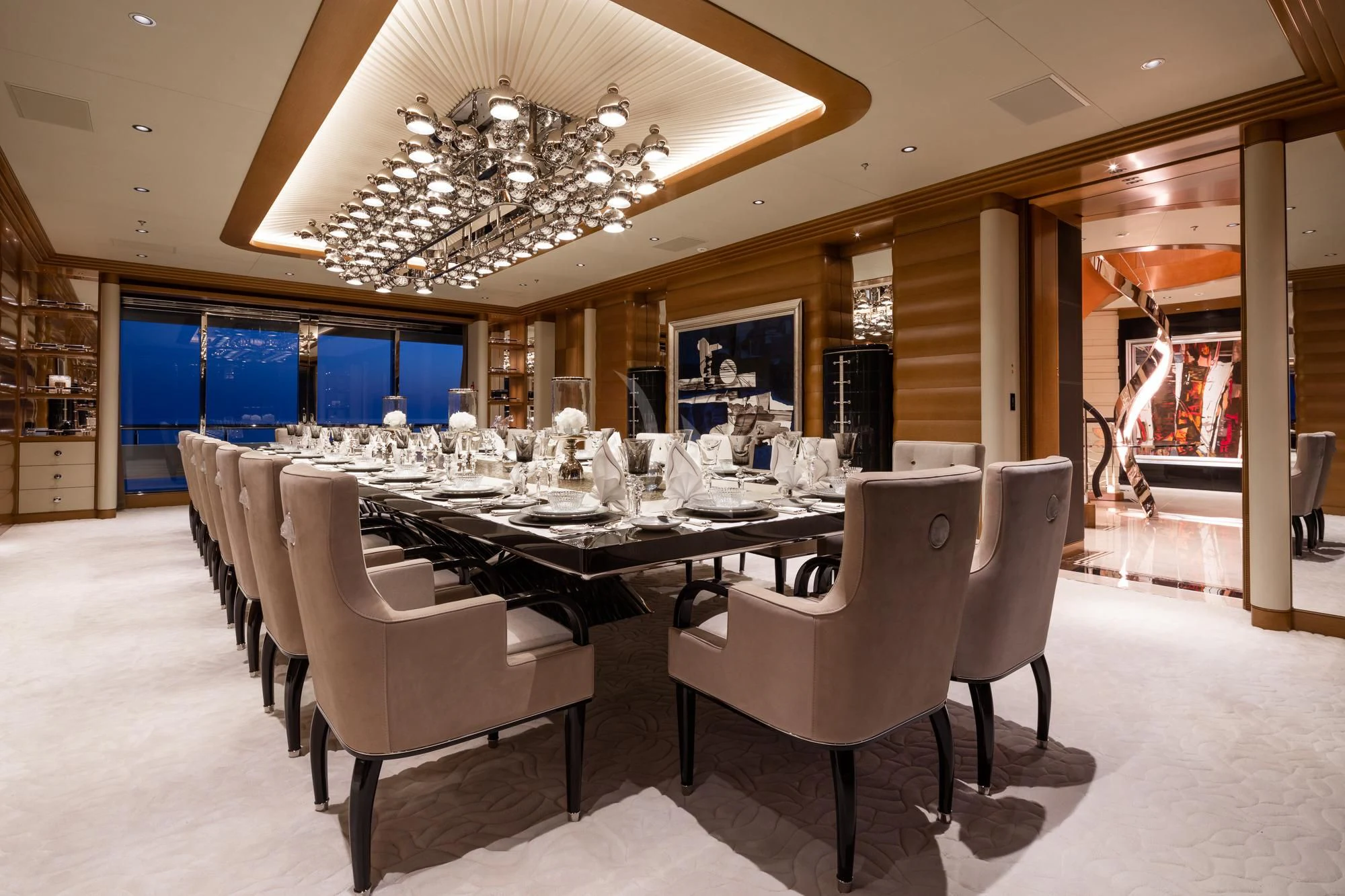 a room with a table and chairs aboard MAR Yacht for Sale