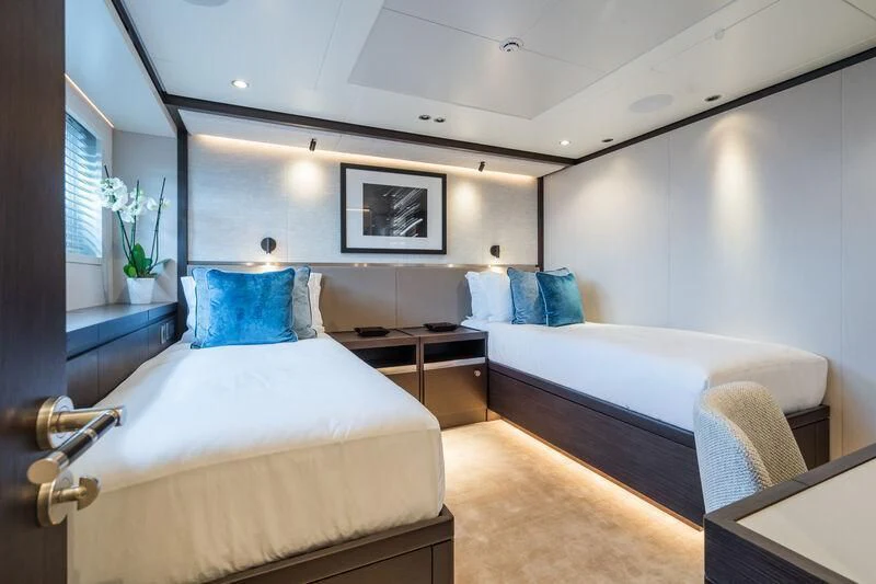 a room with two beds aboard EMERALD Yacht for Charter