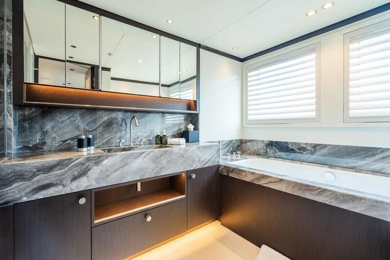 a kitchen with white cabinets aboard EMERALD Yacht for Charter