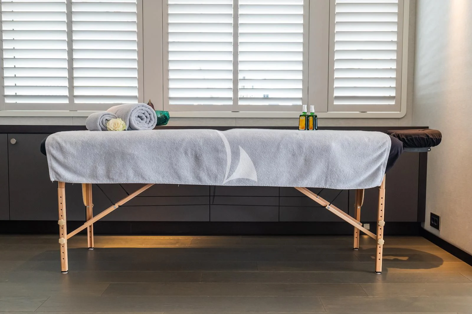a bed with a blue sheet aboard EMERALD Yacht for Charter