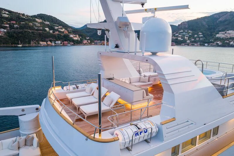 a large white boat in a large body of water aboard EMERALD Yacht for Charter
