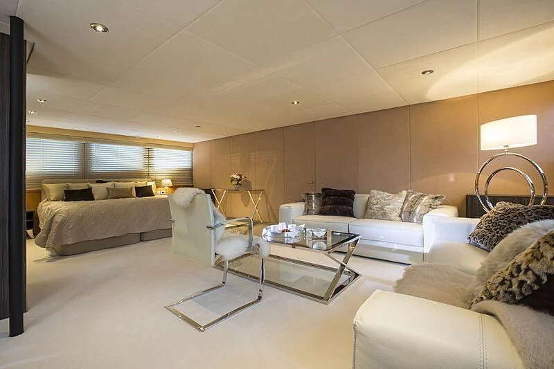 a living room with a couch and a coffee table aboard EMERALD Yacht for Charter