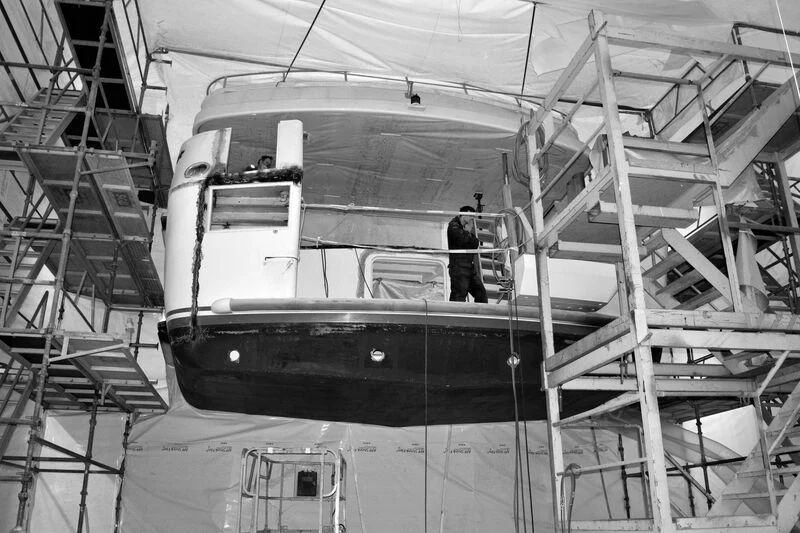 a person standing in a large room aboard EMERALD Yacht for Charter