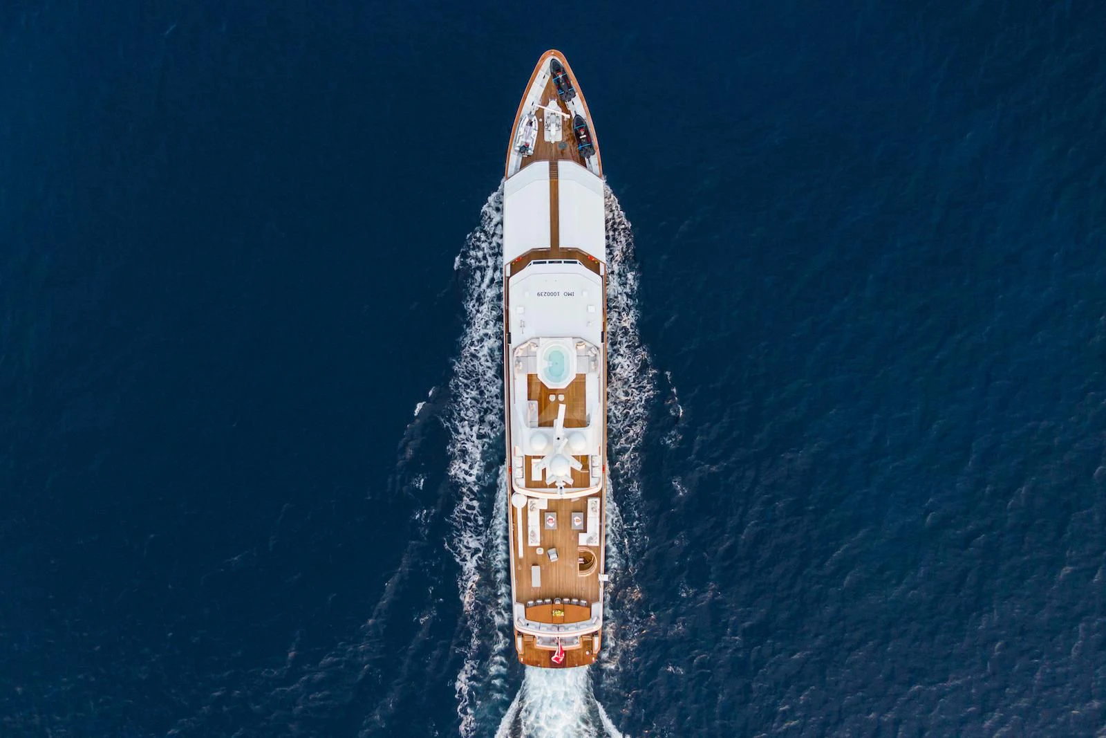 a rocket with a gold design aboard EMERALD Yacht for Charter