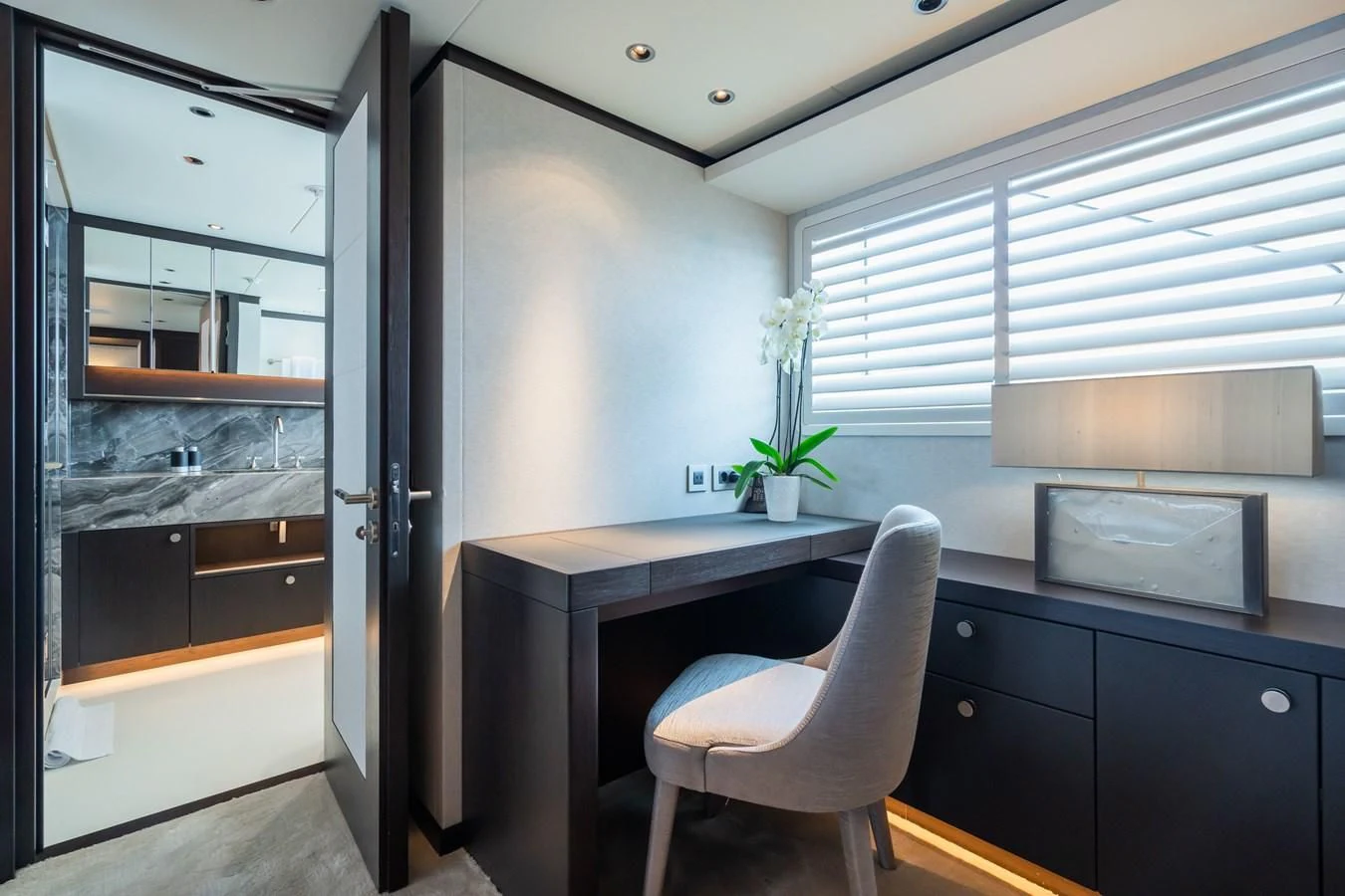 a room with a desk and a chair aboard EMERALD Yacht for Charter