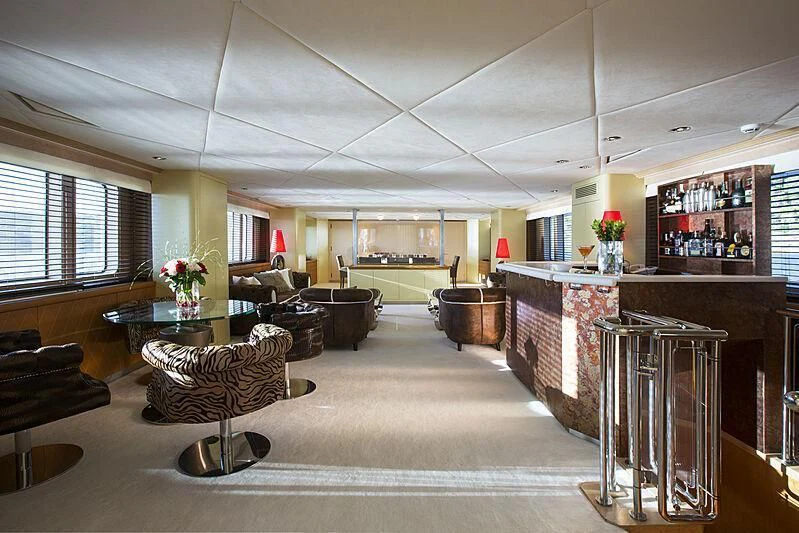 a large room with a table and chairs aboard EMERALD Yacht for Charter