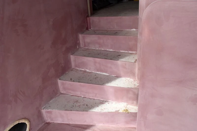 a set of stairs in a stone building aboard EMERALD Yacht for Charter
