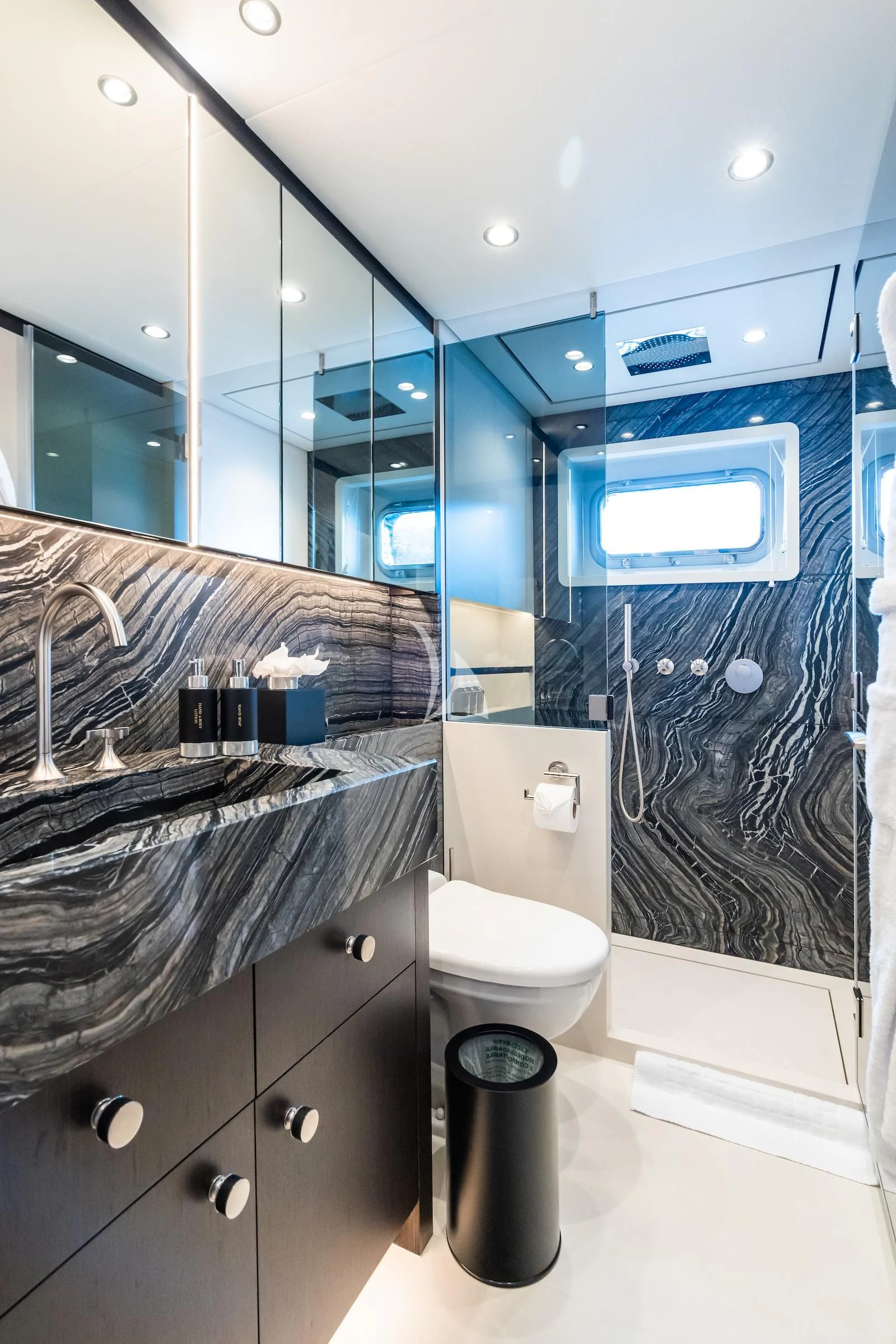 a bathroom with a glass shower aboard EMERALD Yacht for Charter