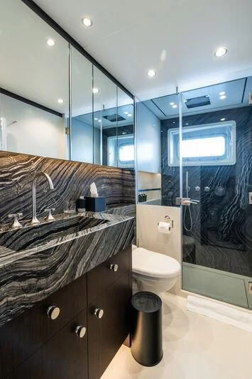a bathroom with a glass shower aboard EMERALD Yacht for Charter