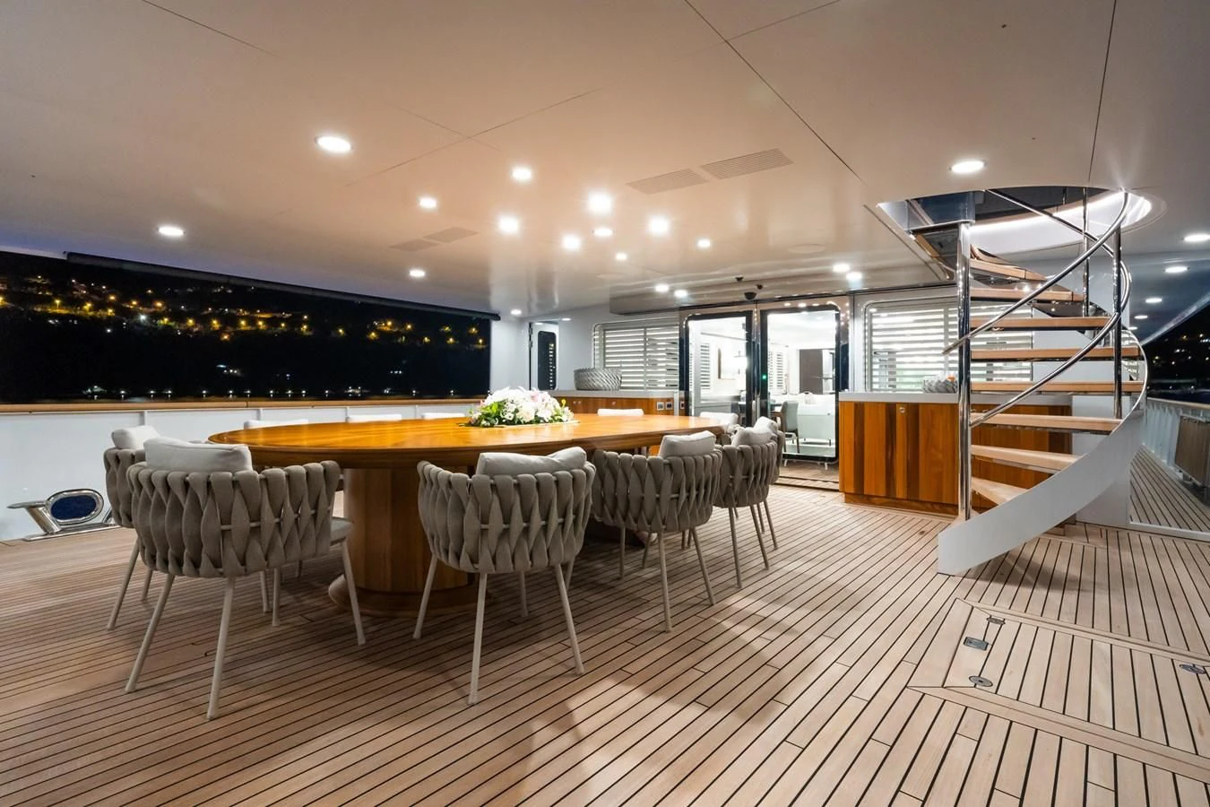 a room with tables and chairs aboard EMERALD Yacht for Charter