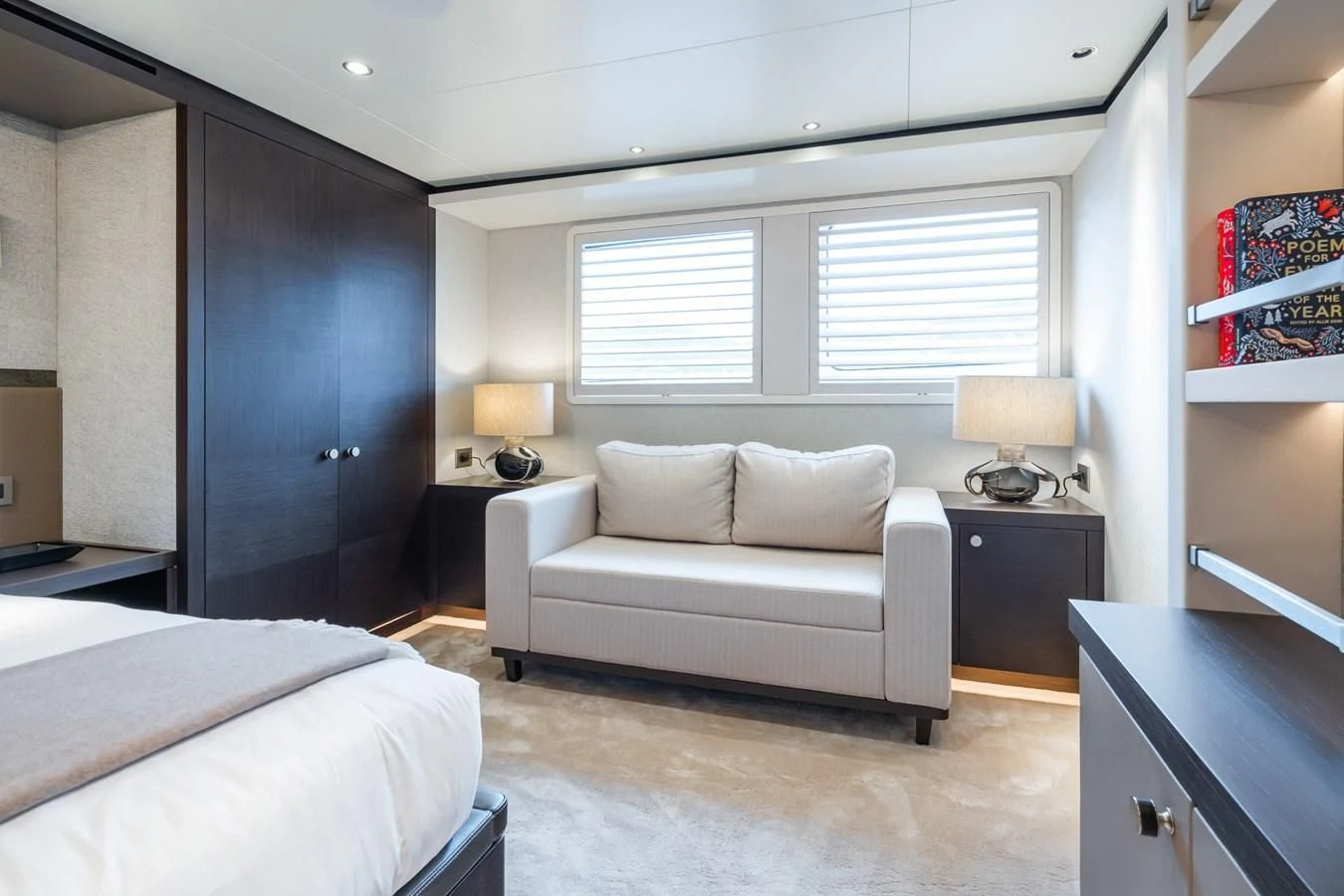 a room with a bed and a desk aboard EMERALD Yacht for Charter