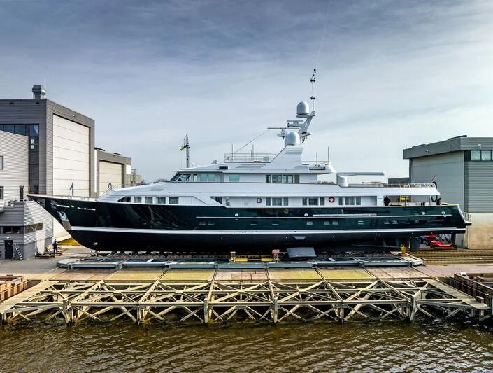 a large ship docked aboard EMERALD Yacht for Charter