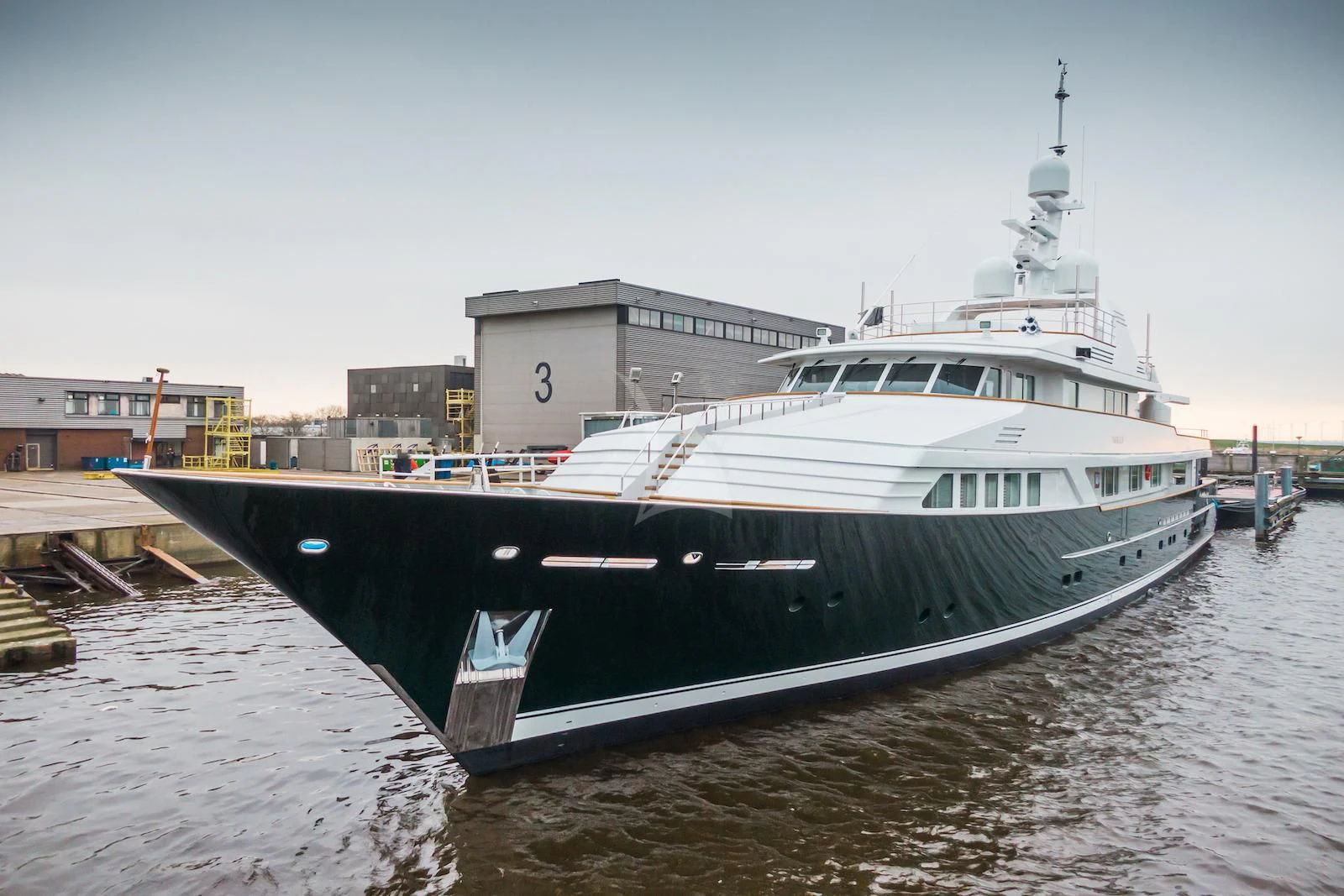 a boat docked at a pier aboard EMERALD Yacht for Charter
