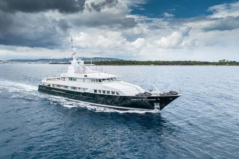 a large white boat on the water aboard EMERALD Yacht for Charter