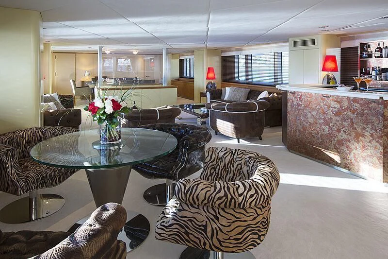 a living room with a table and chairs aboard EMERALD Yacht for Charter