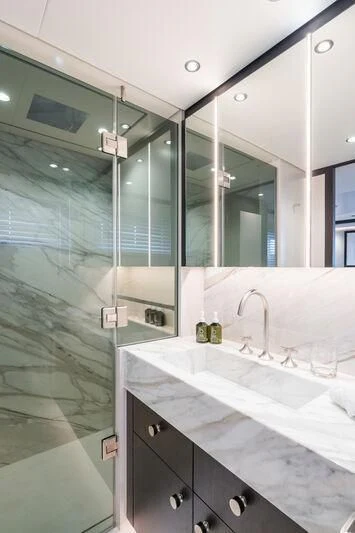 a bathroom with a glass shower aboard EMERALD Yacht for Charter