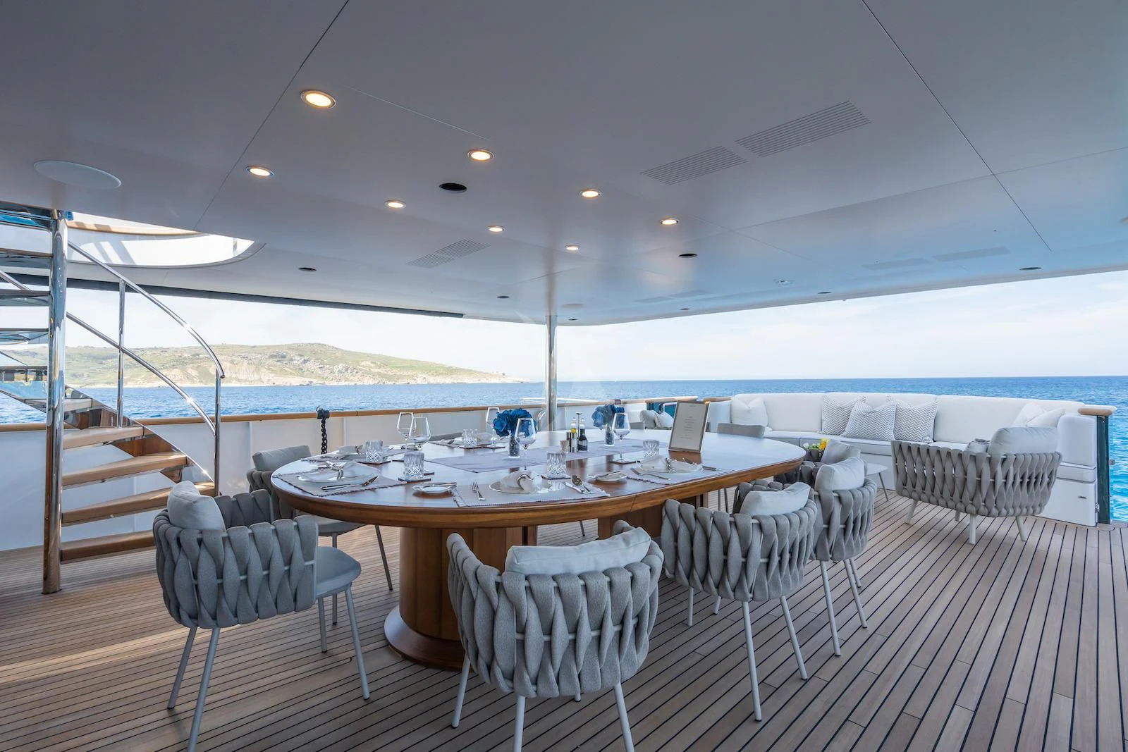 a table set for a dinner party aboard EMERALD Yacht for Charter