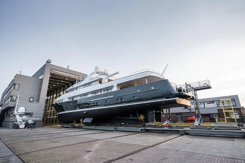 a large metal boat on a dock aboard EMERALD Yacht for Charter