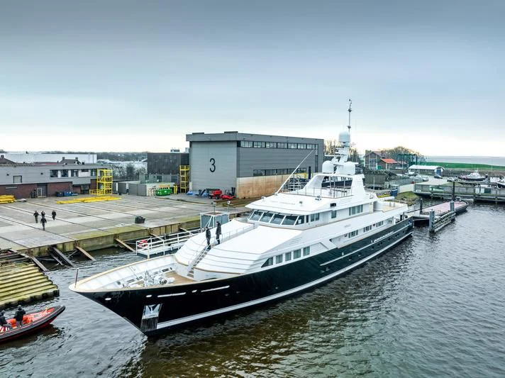 a large white ship docked aboard EMERALD Yacht for Charter