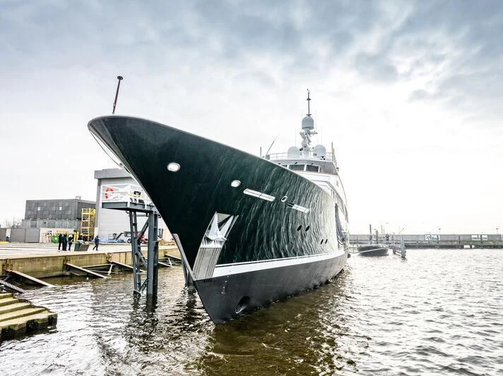 a large ship docked aboard EMERALD Yacht for Charter