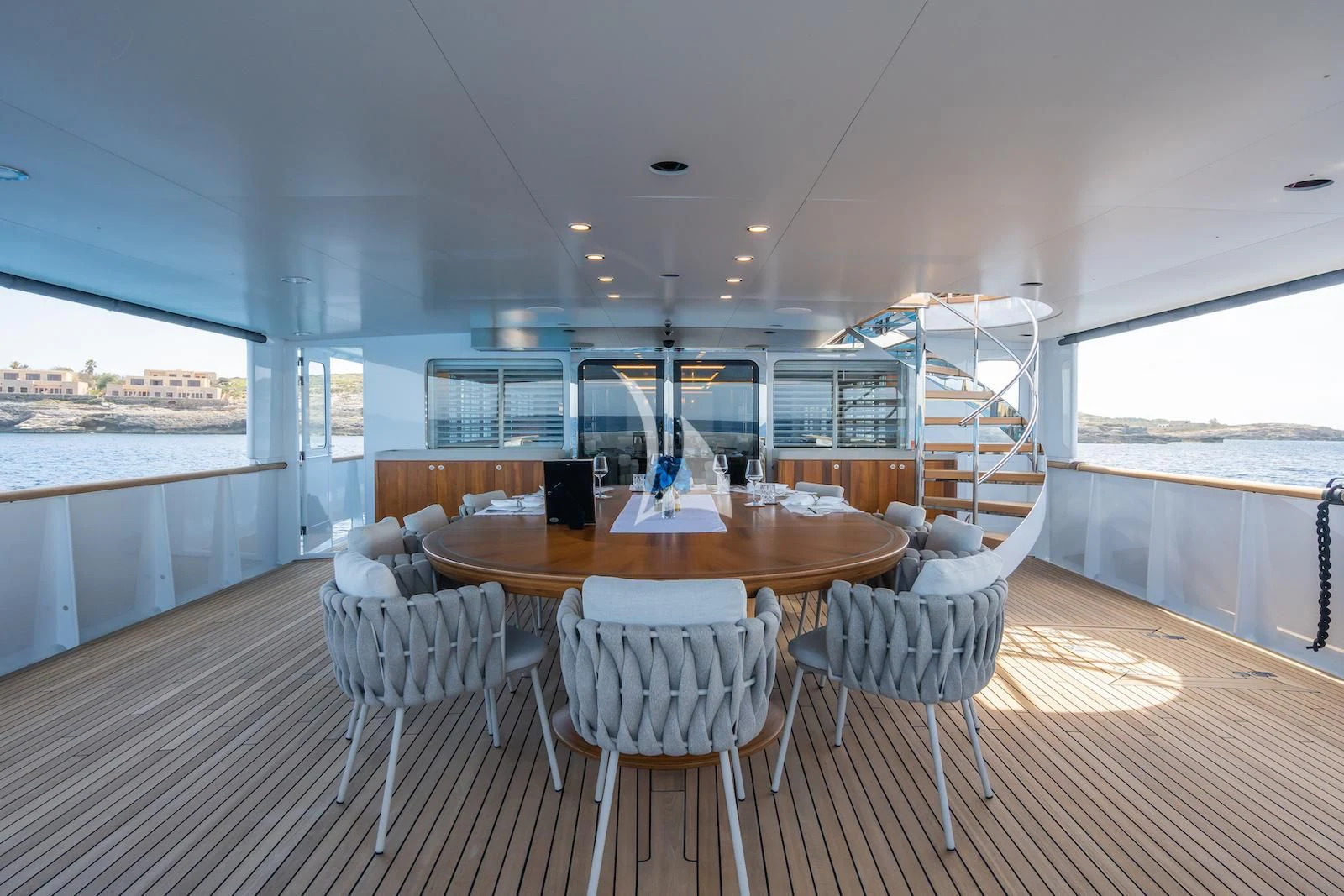 a large dining table in a room aboard EMERALD Yacht for Charter
