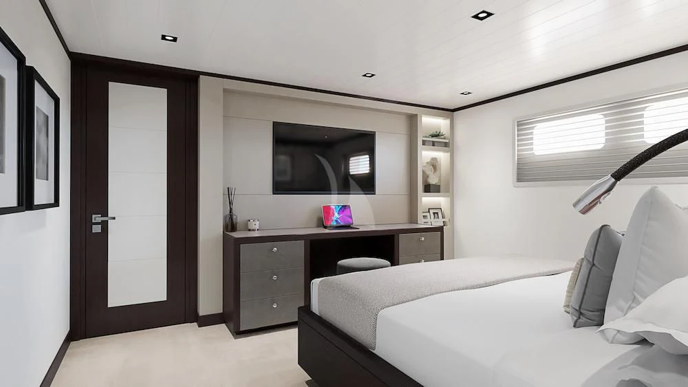 a bedroom with a bed and a desk aboard EMERALD Yacht for Charter