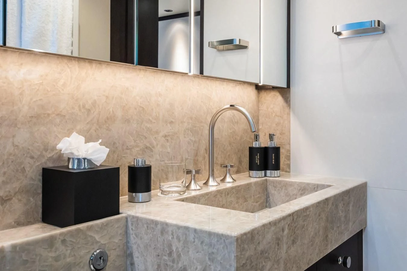 a bathroom with a sink and a mirror aboard EMERALD Yacht for Charter
