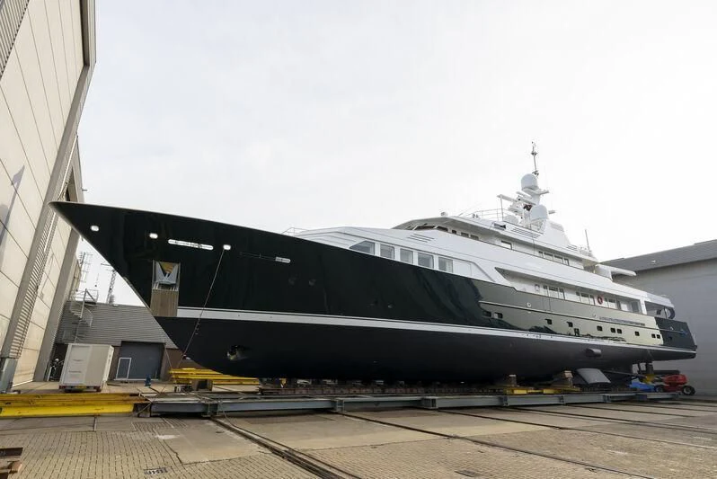 a large cruise ship docked aboard EMERALD Yacht for Charter