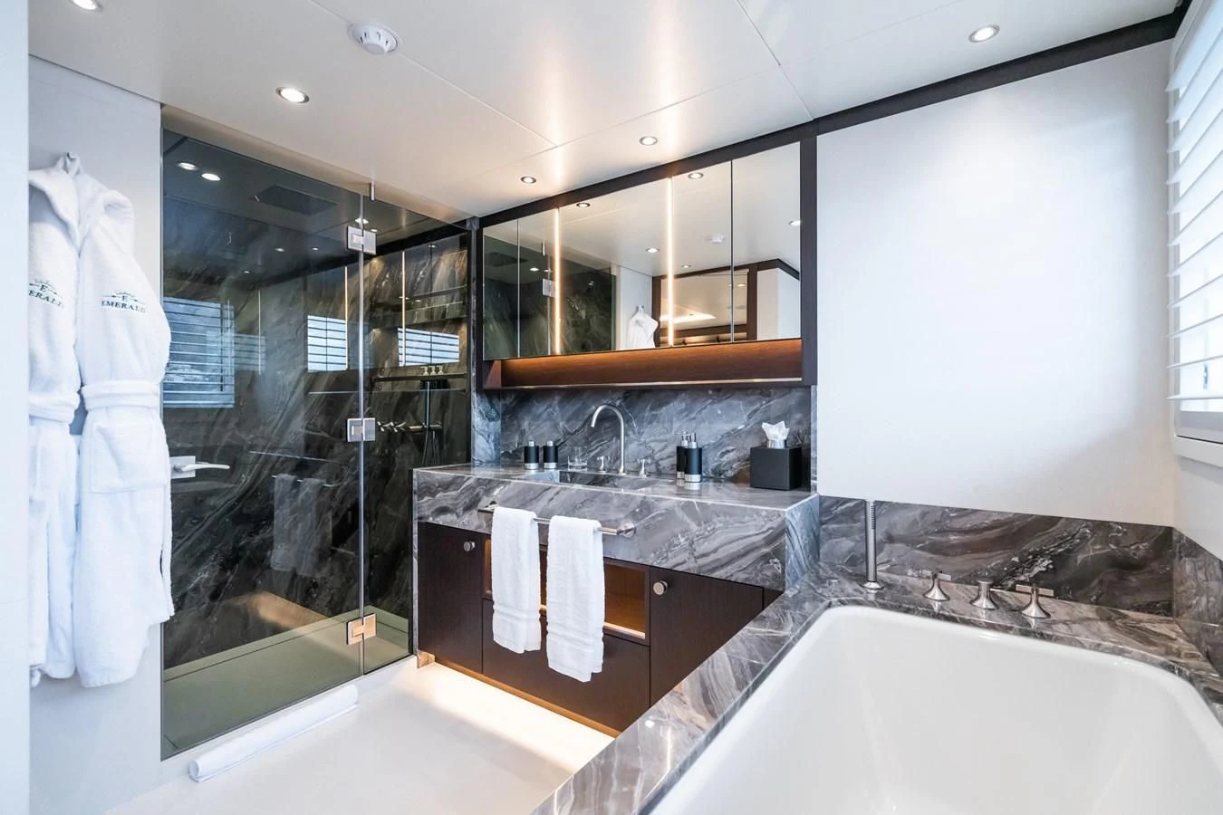 a bathroom with a large mirror aboard EMERALD Yacht for Charter