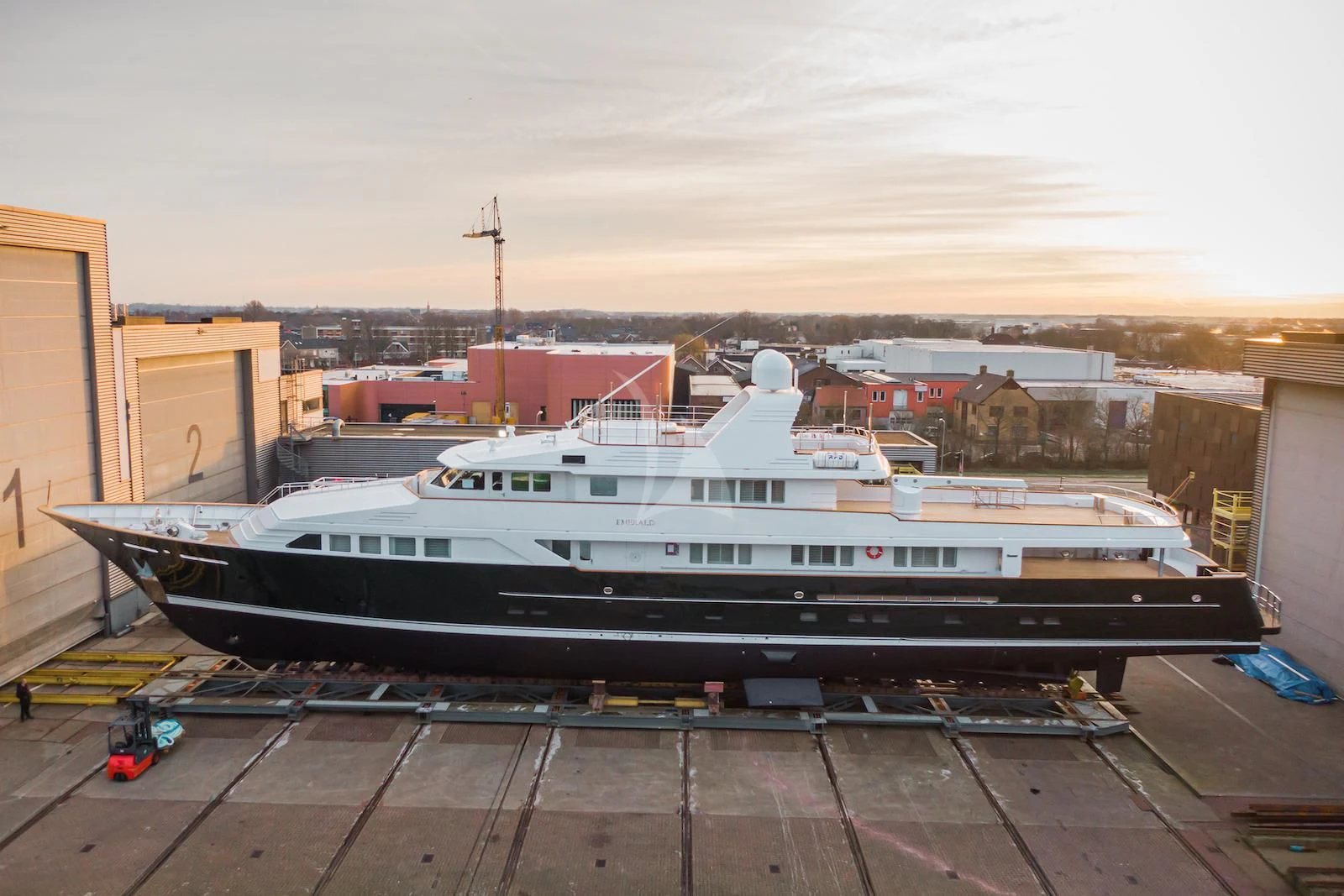 a large ship in a harbor aboard EMERALD Yacht for Charter
