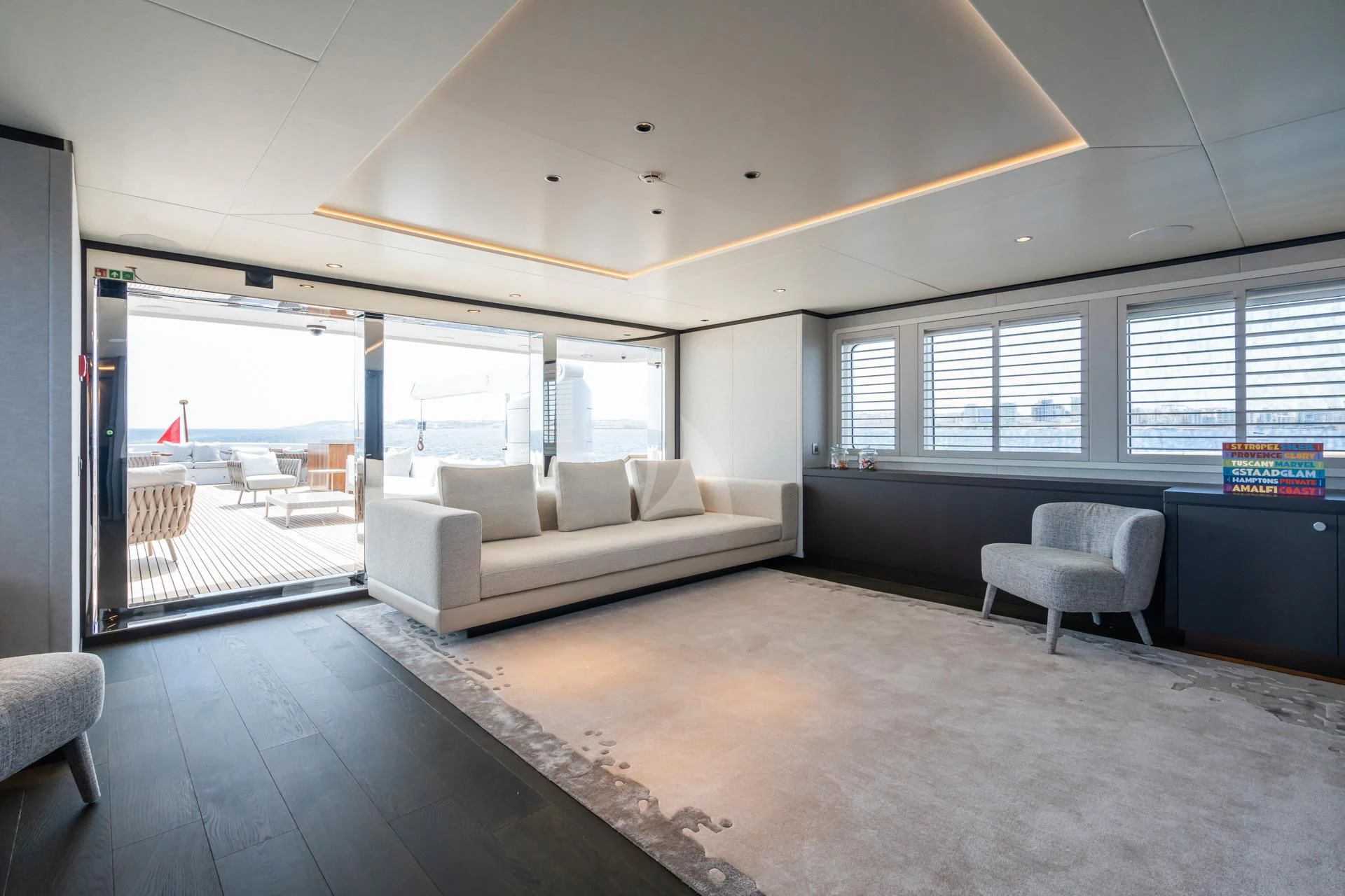 a room with a couch and a table and chairs aboard EMERALD Yacht for Charter